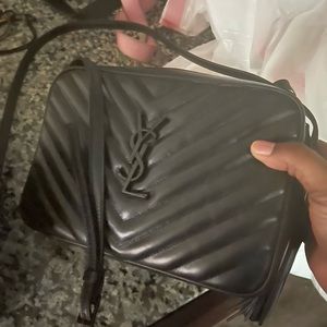 Black crossbody ysl bag.